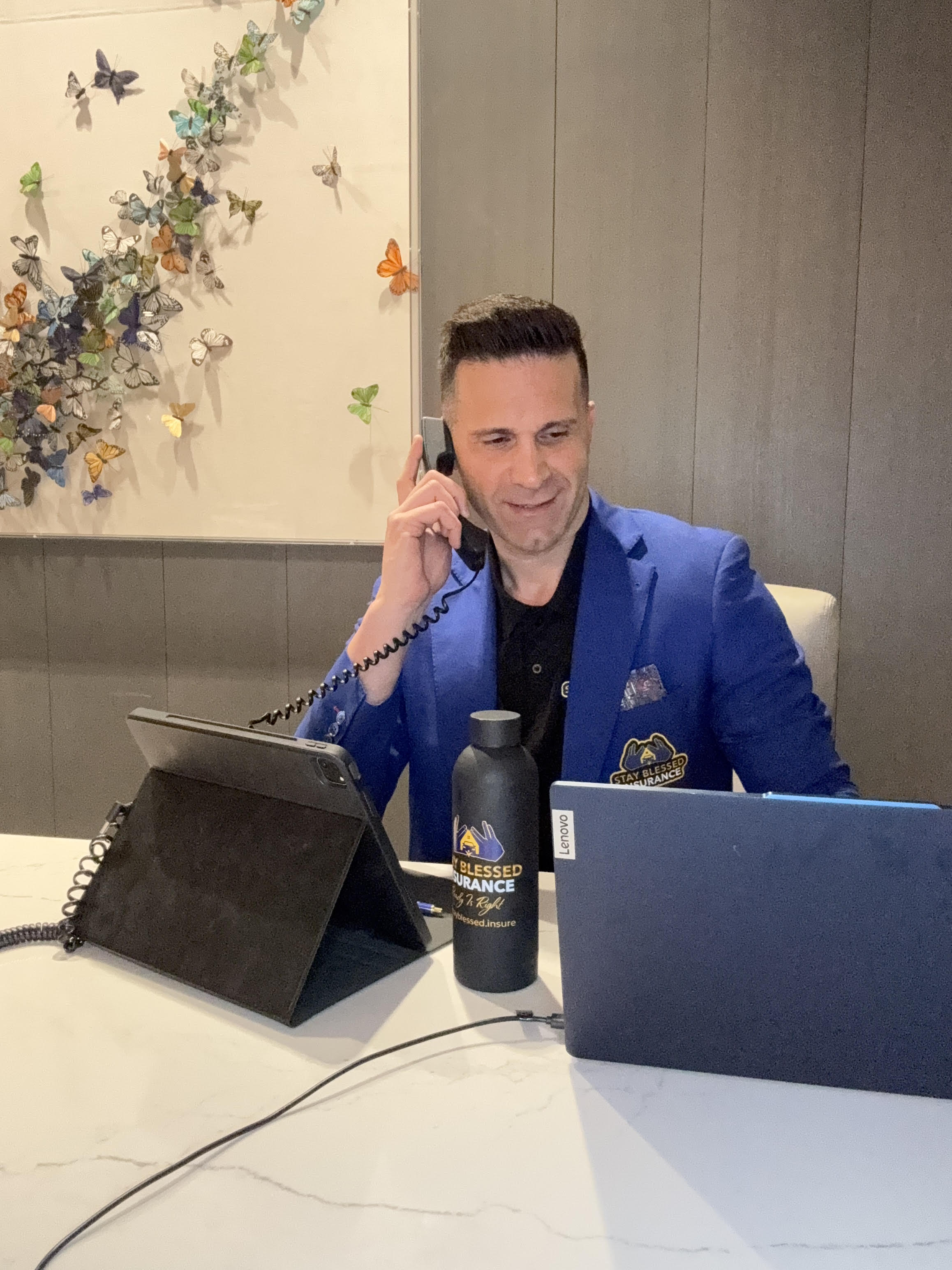 Benny Aminov working with a client — Stay Blessed Insurance